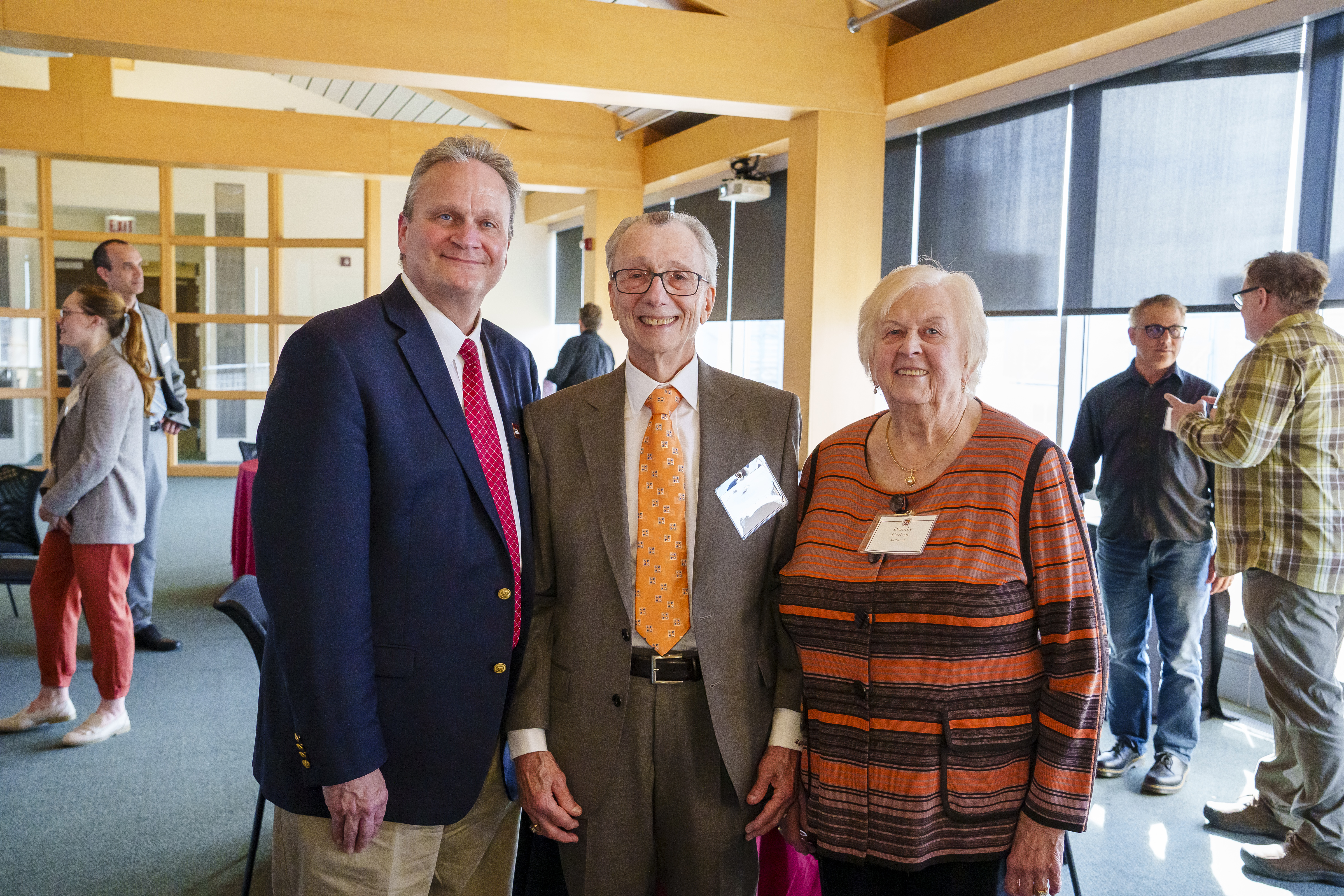 Dr. Michael and Mrs. Dorothy Carbon stand with Dean Peter J. Schraeder