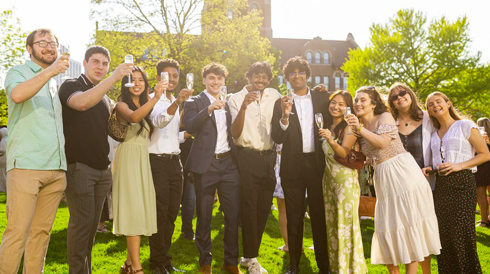 The Class of 2024 raises a glass as they join the ranks of Loyola's newest alumni.