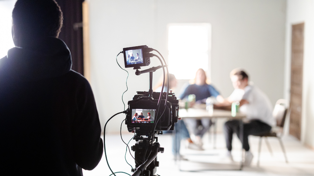 A student uses a camera to capture video.