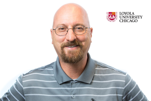 A person wearing glasses and a polo shirt against a white background