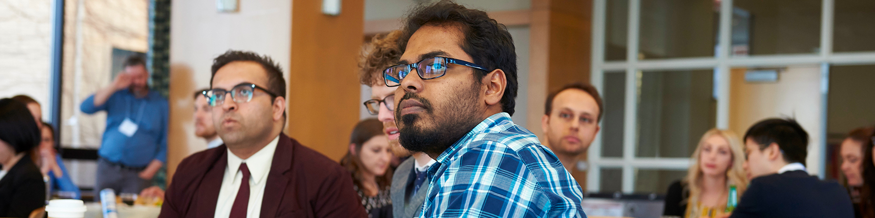 Students give poster presentations at Cuneo Hall and gather for a reception at the McCormick Lounge following the 12th Annual Loyola Graduate School Interdisciplinary Research Symposium