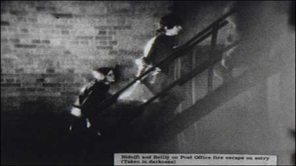 FBI surveillance photo of draft board raiders Kathleen Ridolfi and Rosemary Reilly entering the Camden Federal Building in August of 1971.  Print courtesy of ECC Media, LLC, http://www.camden28.org/ 