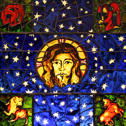 A stained glass window representing the faith of Christianity.