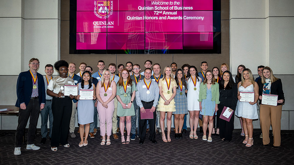 Group of students standing with their awards