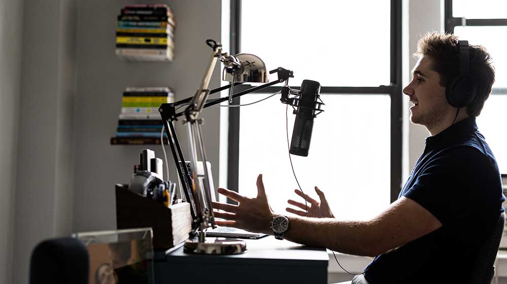 Nicolas Soto Hay records a podcasts in his home studio.