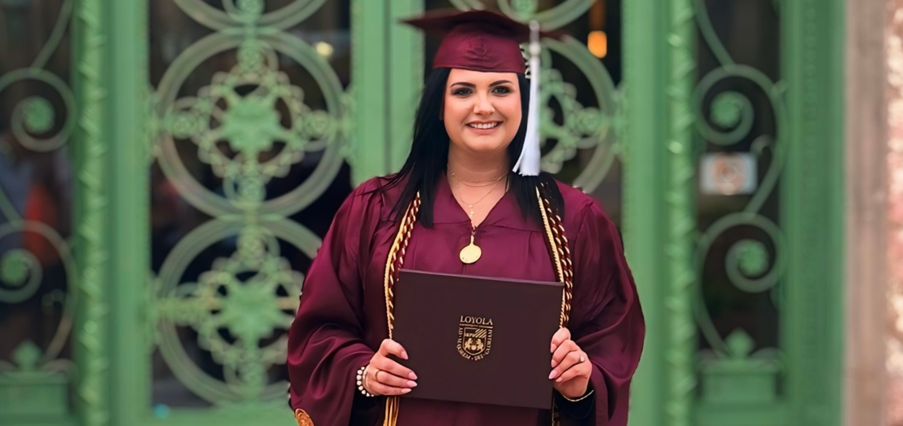 Loyola University Chicago SCPS graduate, Kinga Guza, with her diploma