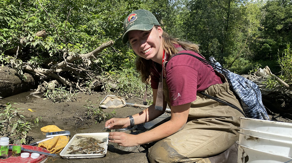 Natalia Szklaruk working in the field sampling small aquatic organisms